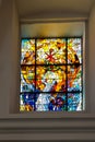 CheÃâm, Poland, 25 September 2020: Stained glass window in the window of the church, the shrine of the Mother of God in CheÃâm in